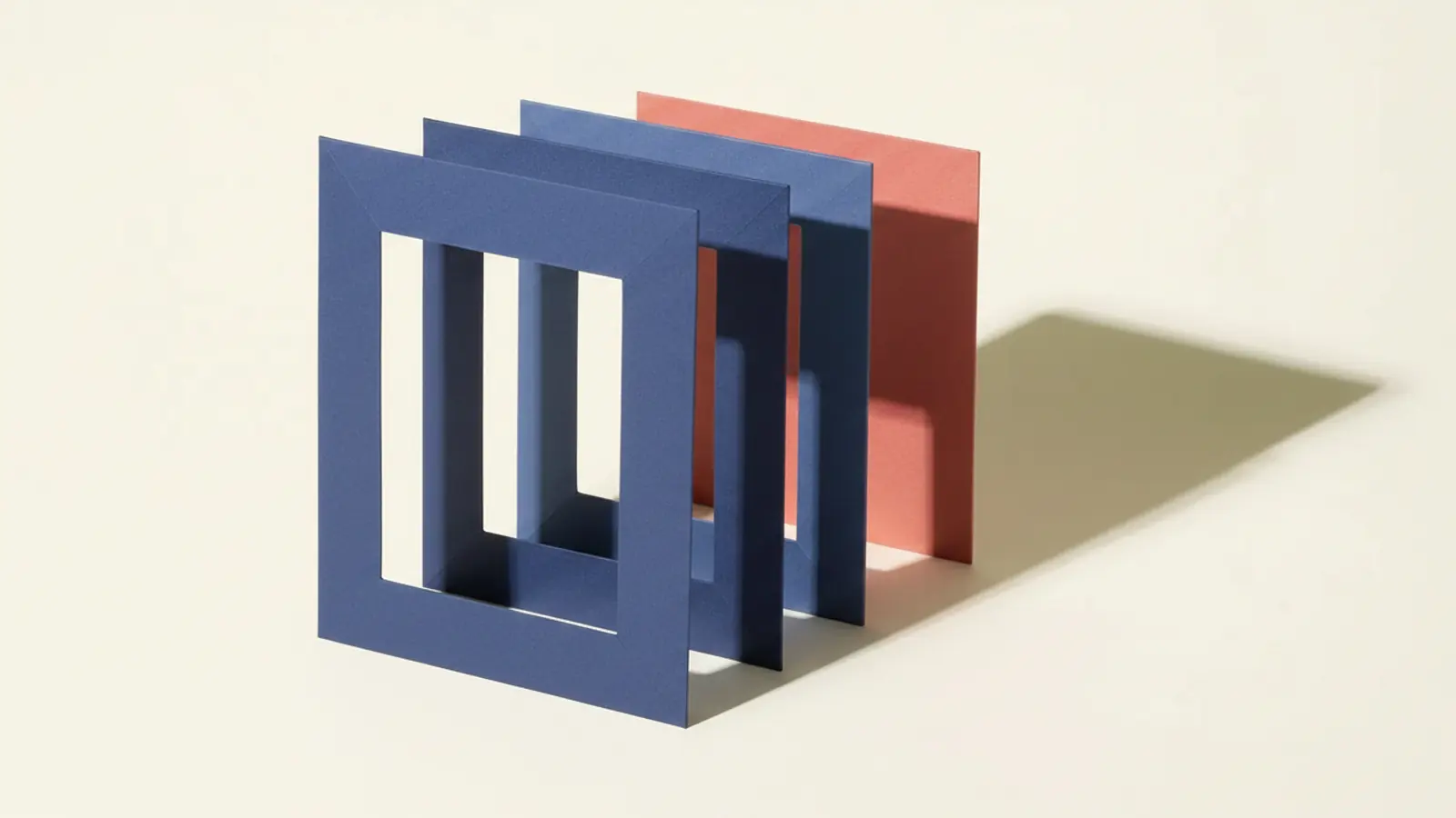 Paper-craft illustration of four blue rectangular frames standing in a row to form a tunnel, its far end closed by a solid red panel